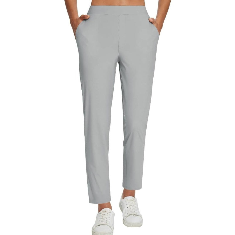 Hoge elastische broek voor dames met zakken met ritssluiting