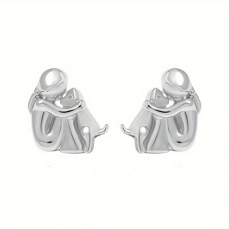 Oorbellen en ketting met kleine meisje dat hond knuffelt